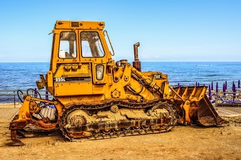 Yellow Truck Near Body of Water