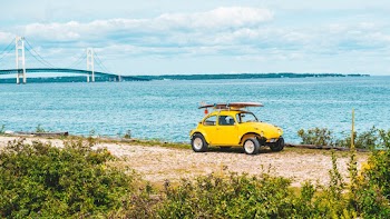 Yellow Volkswagen Beetle On A Seaside