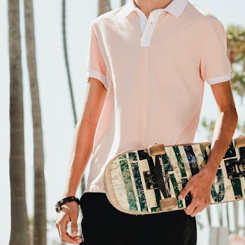 Young adult skater holding a skateboard in… | Free stock photo | High Resolution image