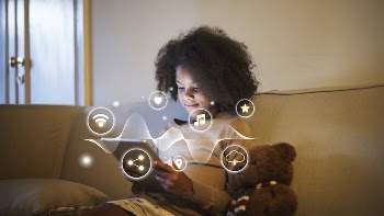 Young African kid using a digital | Free Photo - rawpixel