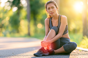 Young Asian Sportswoman Resting After Run