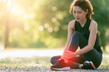 Young Asian Sportswoman Resting in Park After Run