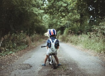 Young boy riding a bike | Free Photo - rawpixel