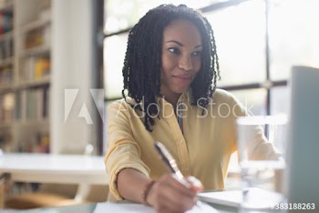 Young businesswoman working at laptop