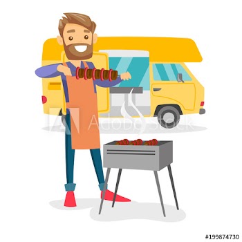Young caucasian white man preparing meat on grill on the background of camper van