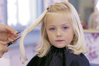Young Child Getting Haircut at Salon
