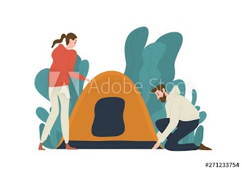 Young couple setting up tent on campsite