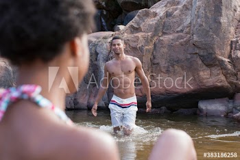 Young couple swimming in lake