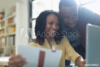 Young couple using laptop