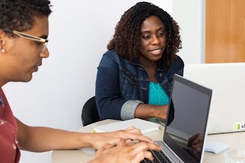 Young Developers At Work In Office