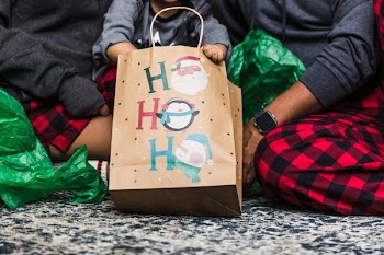 Young Family Opens Christmas Gifts Together