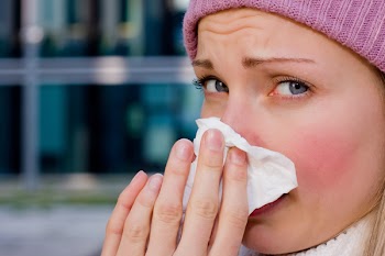 young female having a cold