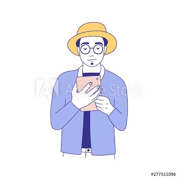 Young hipster man dressed in stylish clothes reading e-book