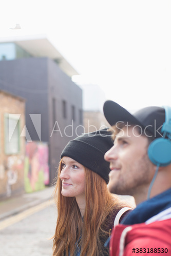 Young man and woman on city street