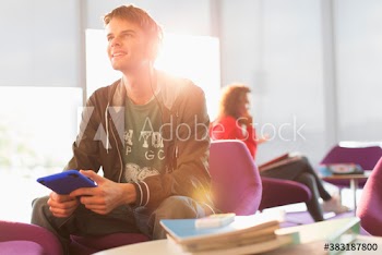 Young man listening to music with headphones and digital tablet