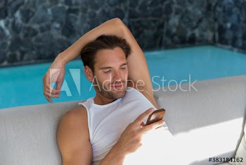 Young man relaxing with smart phone