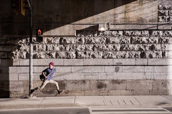 Young Man Runaway On Urban Street