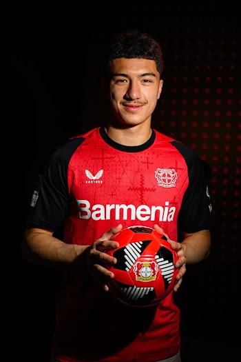 Young Soccer Player with Football