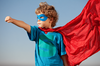 Young Superhero with Flowing Cape