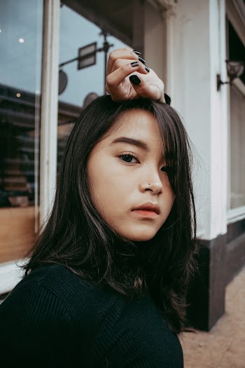 Young Woman In Black Turtleneck Knitted Wear