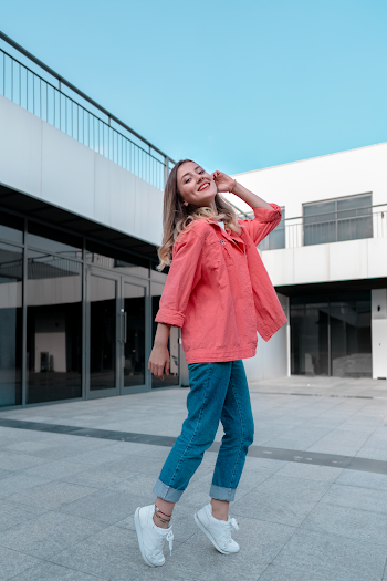Young Woman In Casual Wear Posing Tiptoed