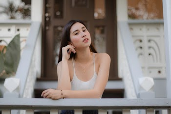 Young Woman in White Spaghetti-strap Top