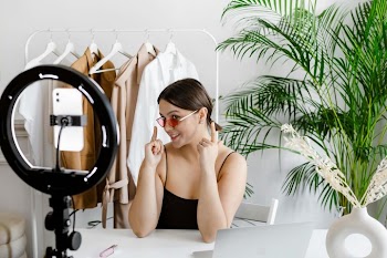 Young Woman Making Vlog at Home with Ring Light
