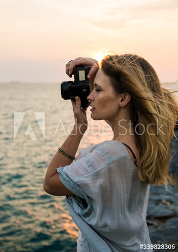 Young Woman Taking Pictures Concept
