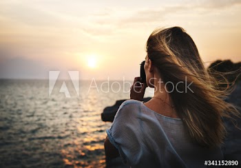 Young Woman Taking Pictures Concept