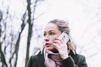 Young woman talking on the phone outdoors