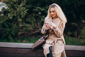 Young woman wear trench-coat and glasses