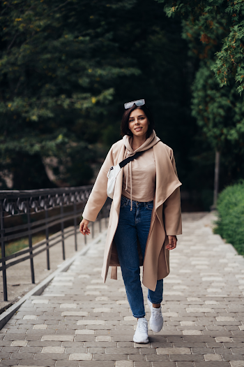 Young woman wear trench-coat and glasses