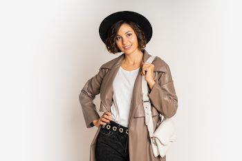 Young woman wearing a leather trench-coat