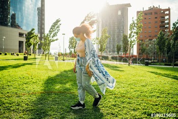 Young woman wearing medical mask walking in park