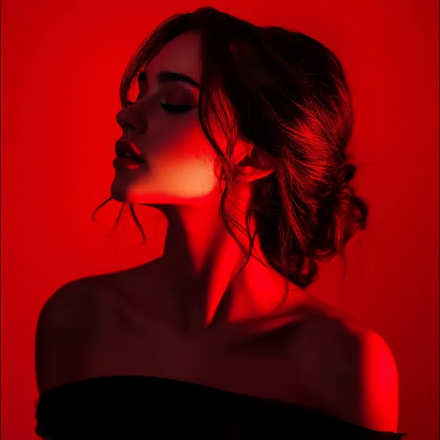 a woman in a black dress with a red background