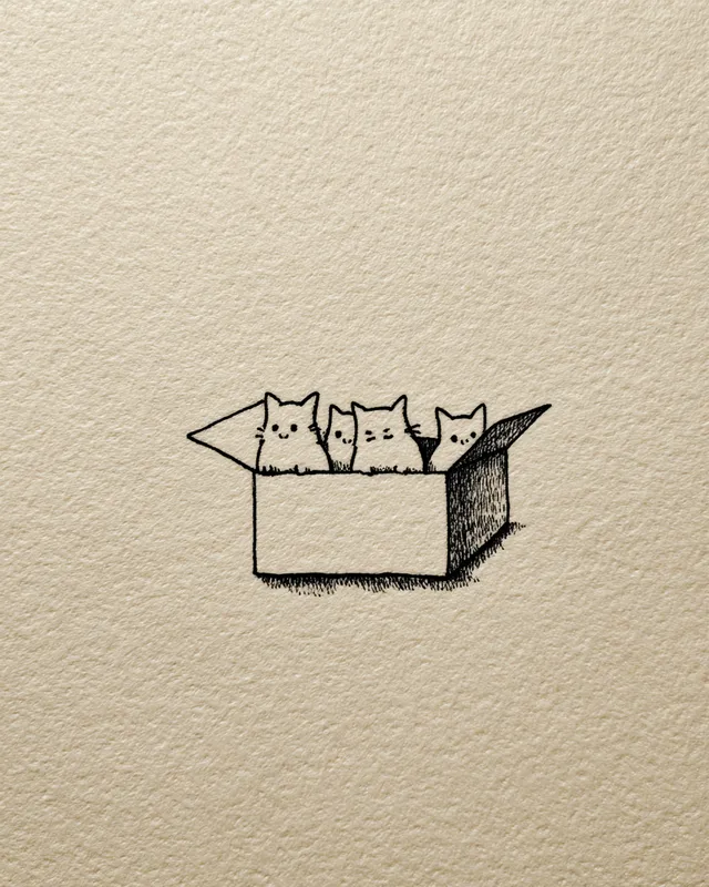 Adorable Cats Peeking from a Box