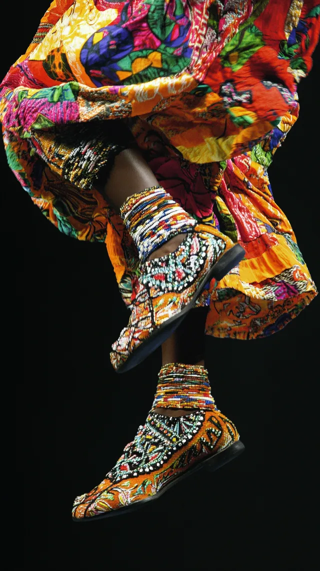 Afro Footwear with African Clothing Dancing in a Vibrant Urban Setting