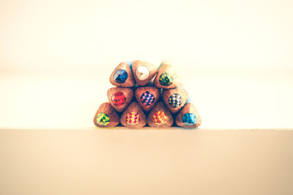 Assorted-color Colored Pencils on Beige Surface