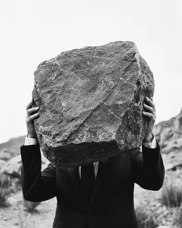 Burdened Elegance: Surreal Portrait of a Man in a Suit